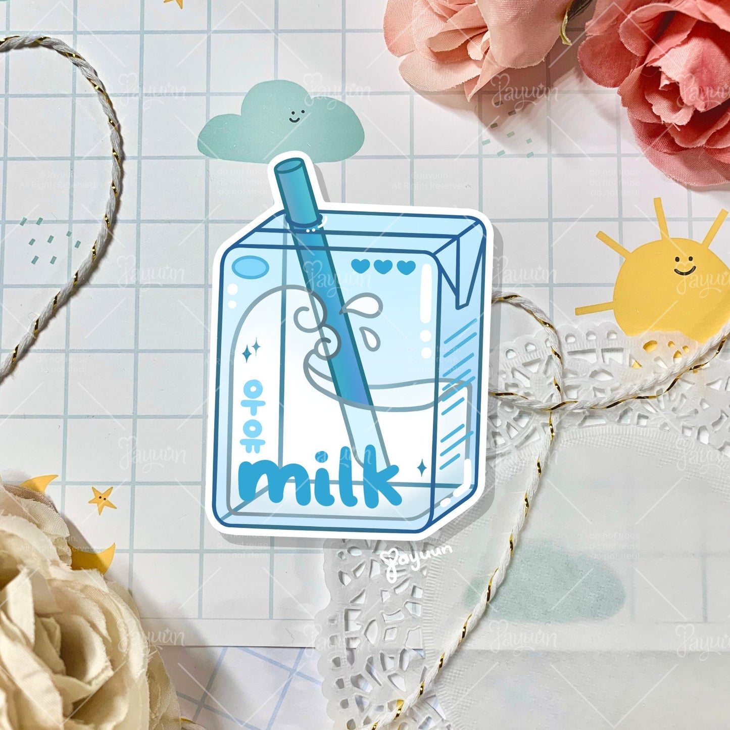 Blue milk carton sticker shown on a decorative paper background