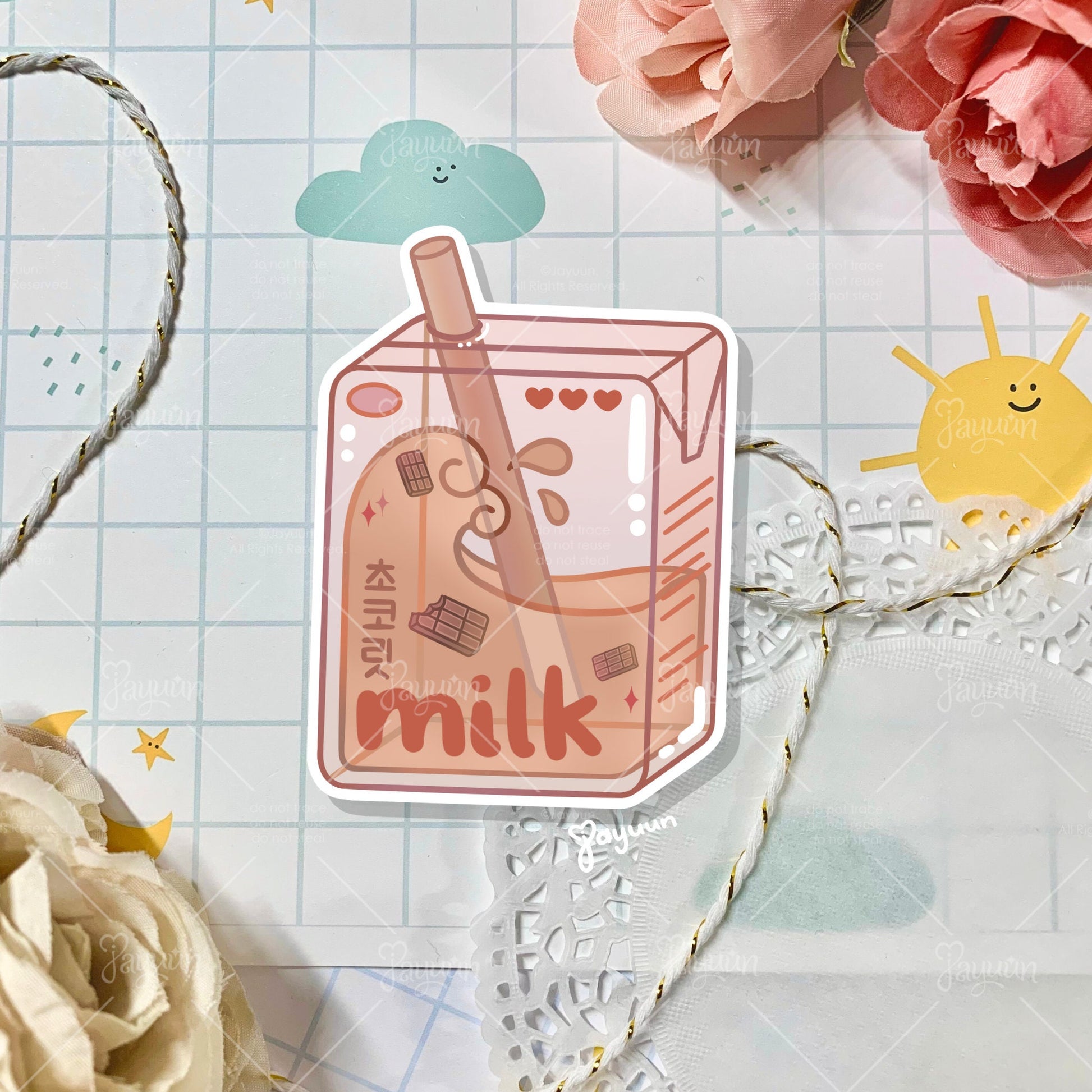 Brown chocolate milk carton sticker shown on a decorative paper background