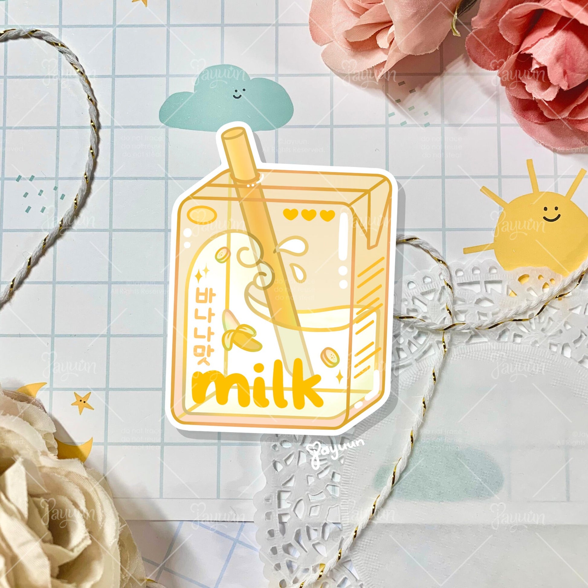 Yellow banana milk carton sticker shown on a decorative paper background