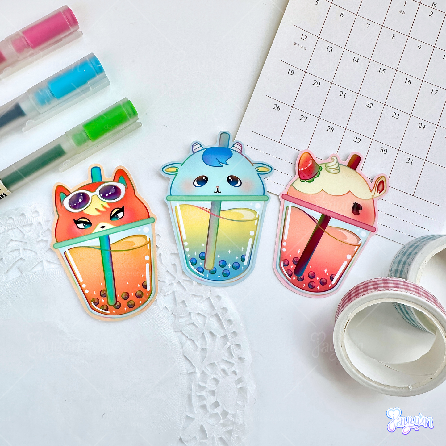 Sherb, Merengue, and Audie-inspired boba drink stickers photographed on a white desk background.