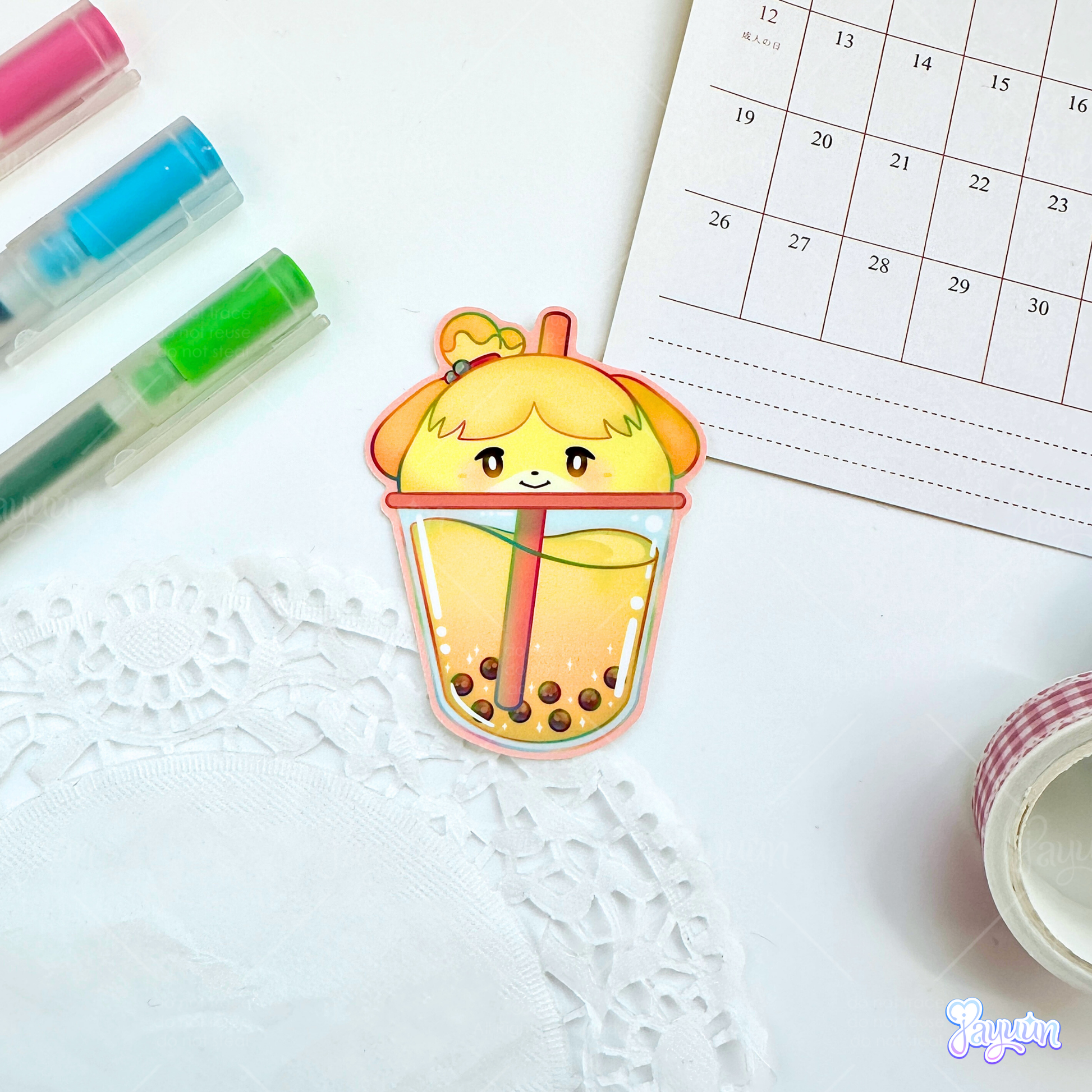 Isabelle-inspired boba sticker photographed on a white desk background.