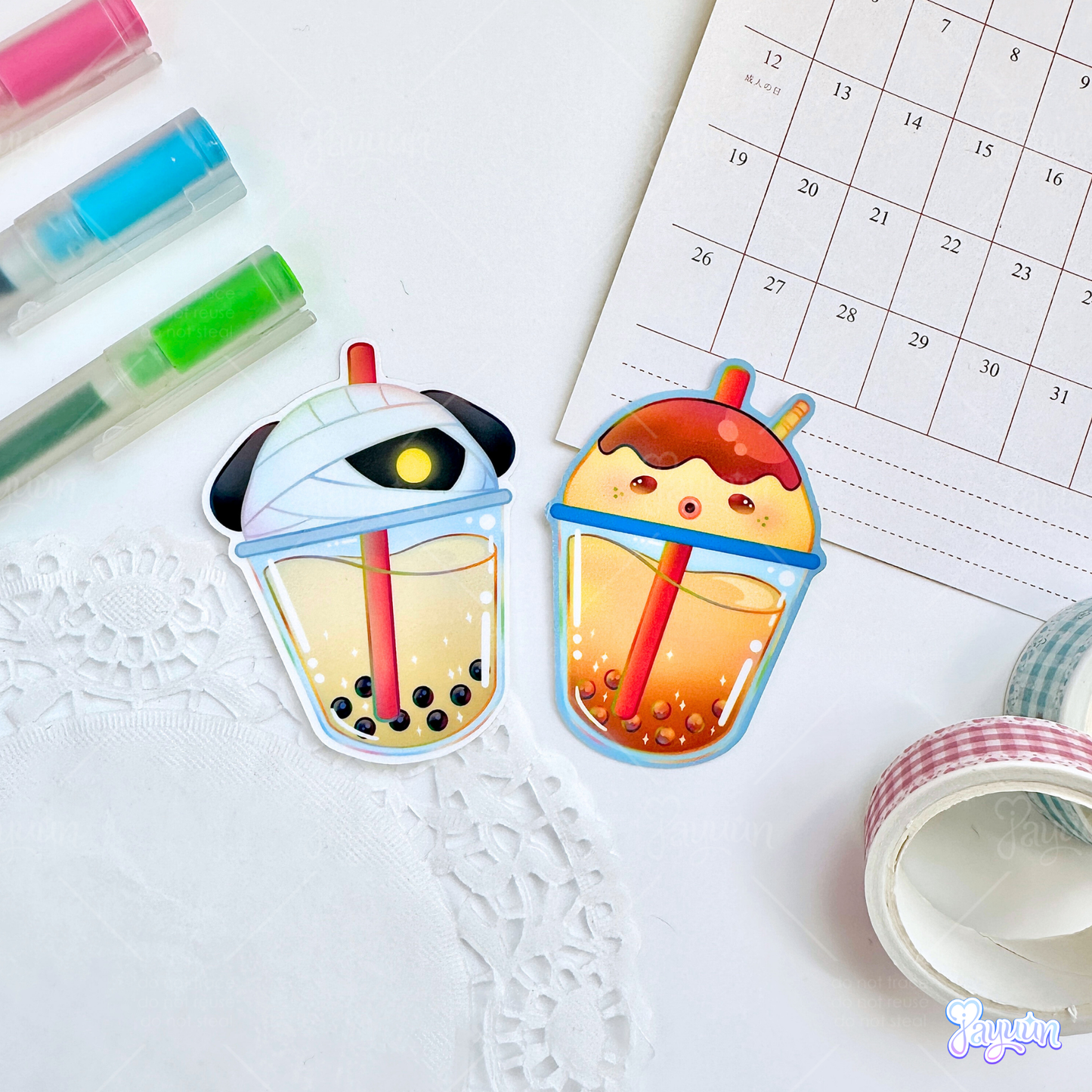 Lucky and Zucker-inspired boba stickers photographed on a white desk background.